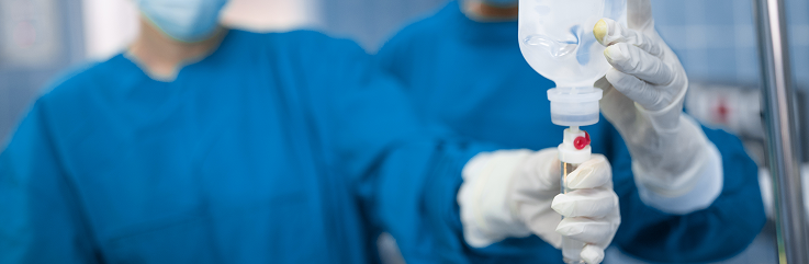 Healthcare worker with IV drip